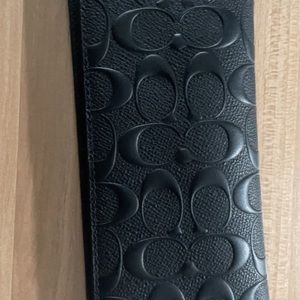 Brand new coach checks wallet